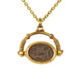 SWIVEL GOLD PENDANT WITH EGYPTIAN SCARAB