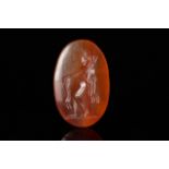 ROMAN CARNELIAN INTAGLIO DEPICTING A GENIUS