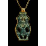EGYPTIAN FAIENCE BES AMULET IN LATER GOLD PENDANT