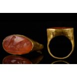 ROMAN CARNELIAN INTAGLIO WITH FIGHTING COCKERELS