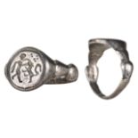 MEDIEVAL SILVER RING WITH A FIGURE AND ANIMAL FIGHTING