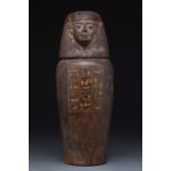 AN EGYPTIAN WOODEN NEW KINGDOM CANOPIC JAR - WITH REPORT