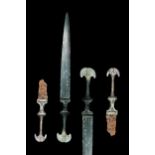 PAIR OF WESTERN ASIATIC BRONZE AND IRON DAGGERS