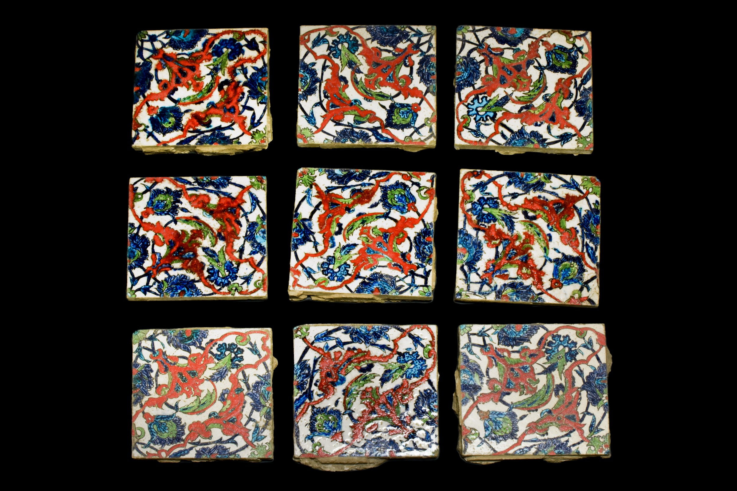 OTTOMAN GROUP OF NINE POLYCHROME IZNIK TILES WITH LOTUS BLOSSOMS