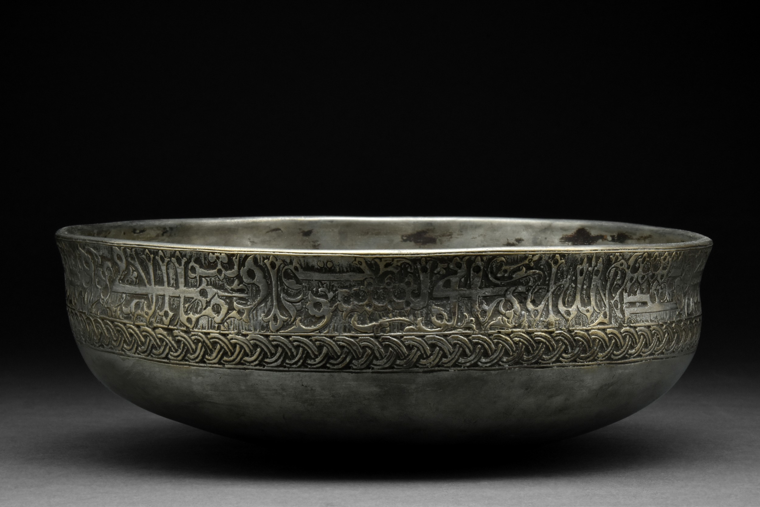 SAFAVID TINNED COPPER BOWL WITH KUFIC SCRIPT WEAVE