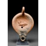 ROMAN TERRACOTTA OIL LAMP WITH DOLPHIN