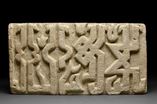 FATIMID INSCRIBED STONE PANEL IN ELONGATED KUFIC