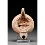 ROMAN TERRACOTTA OIL LAMP WITH DOLPHIN AND RUDDER