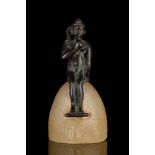 EGYPTIAN BRONZE SEATED HARPOCRATES ON ALABASTER BASE