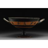 ATTIC BLACK-FIGURE BAND KYLIX WITH ATHLETES