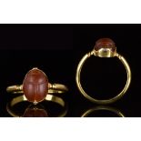 ANCIENT EGYPTIAN CARNELIAN SCARAB IN NEO-CLASSICAL GOLD RING