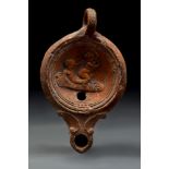 ROMAN TERRACOTTA OIL LAMP WITH EROTIC SCENE