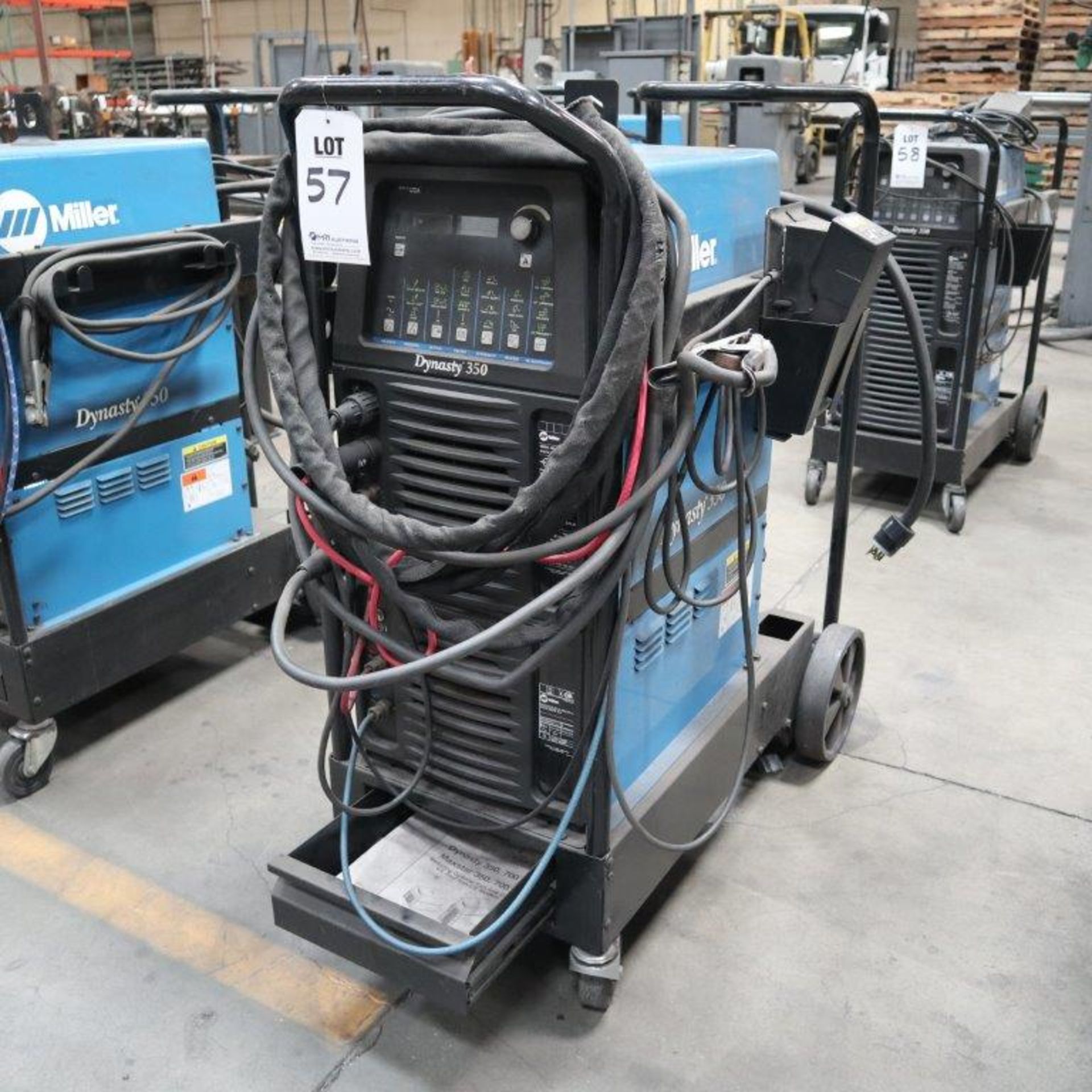 MILLER DYNASTY 350 AC/DC TIG AND STICK WELDER, WATER COOLED, WITH ROLLING CART WITH CABLES, S/N