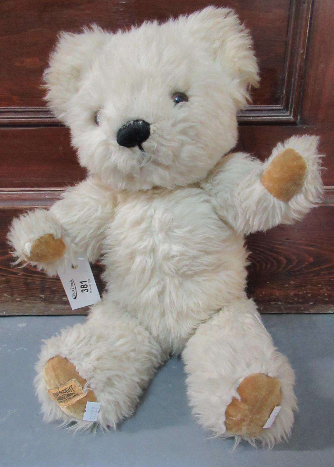 Merrythought teddy bear with stitched nose, glass eyes and movable limbs. (B.P. 21% + VAT)