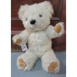 Merrythought teddy bear with stitched nose, glass eyes and movable limbs. (B.P. 21% + VAT)