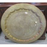 Large Middle Eastern brass tray in Persian foliate style. 88cm diameter approx. (B.P. 21% + VAT)