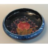 Moorcroft art pottery tube lined pomegranate design bowl, signed to the under side and impressed