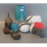 A collection of modern art pottery to include; vases and pebble sculptures, signed to the base of