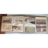 Art nouveau postcard album marked South Africa with various postcards, Boer War camps, African