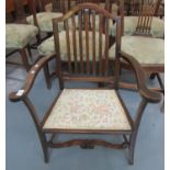 Mid Century stained beech low occasional elbow chair or nursing chair with padded seat, scrolled