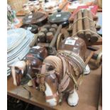 Two vintage ceramic Shire horses in harness, one pulling a brewery cart with six wooden barrels, the