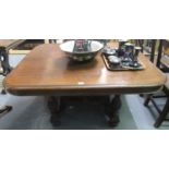 Late 19th Century oak extending breakfast table of rectangular form with additional leaf on a