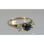 9ct gold sapphire and cz three stone ring. Ring size N. Approx weight 2.2 grams. (B.P. 21% + VAT)