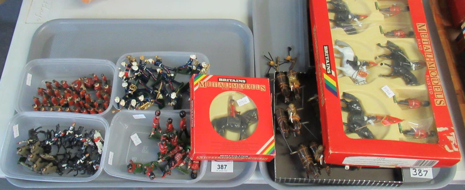 Two trays of Britains and other metal model painted lead soldiers, some in original boxes and some