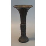 Chinese bronze Gu ceremonial wine vessel with flared neck, overall decorated with archaic design