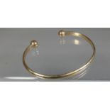 9ct gold torc bangle. Approx weight 16 grams. (B.P. 21% + VAT)