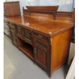 Late Victorian pollard or burr oak sideboard base having low flute moulded back over centre