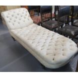 Late Victorian deep buttoned chaise longue or scroll ended day bed, with baluster turned legs and
