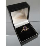 9ct gold dress ring set with an oval amethyst. Ring size O. Approx weight 3.1 grams. (B.P. 21% +