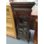 Early 20th Century narrow mahogany pedestal with glazed door on cabriole legs. 44cm wide approx. (
