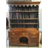 19th Century oak two stage open back dog kennel dresser, the moulded top above iron hooks with