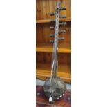 Small West African Kora stringed instrument with studded body and 10 tuning heads. (B.P. 21% + VAT)