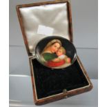 Large oval porcelain brooch hand painted with Madonna and child. Set in silver. (B.P. 21% + VAT)