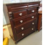 Late Victorian mahogany veneered straight fronted chest of drawers, having two moulded cushion