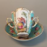 Continental two handled cabinet cup and saucer decorated with courting couples and flowers, blue