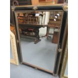 Modern gilt and ebonised frame rectangular mirror with bevelled plate. (B.P. 21% + VAT)