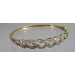 9ct gold diamond set half hoop bangle. Diamond weight 0.25cts in total. Approx weight 9.9 grams. (