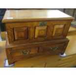 Well made reproduction Welsh oak coffwr bach, having raised and fielded panels to the front on a