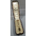 Three srone diamond stick pin of old cut diamonds in milligrain setting. In James Walker Ltd box. (