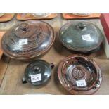 Group of Nigerian Abuja stoneware pottery items to include; two circular tureens and covers, both