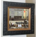 Black foliate framed mirror with square bevelled plate, overall 39cm square approx. (B.P. 21% + VAT)
