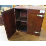 Small mahogany table top, two-door blind panel cabinet, the interior revealing four dividers with
