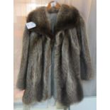 A vintage raccoon fur jacket. (B.P. 21% + VAT) Slightly musty. few small brown stains to lining.