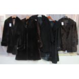 Two vintage black Astrakhan fur coats, a calf skin coat with Astrakhan collar and two mouton or