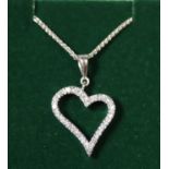 9ct white gold heart pendant set with white stones. Approx weight 5.4 grams