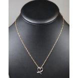 White metal diamond set heart on 9ct gold chain. Approx weight 2.3 grams. (B.P. 21% + VAT)